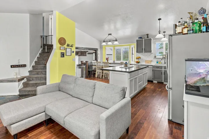 Open-concept living space with wood-finish flooring