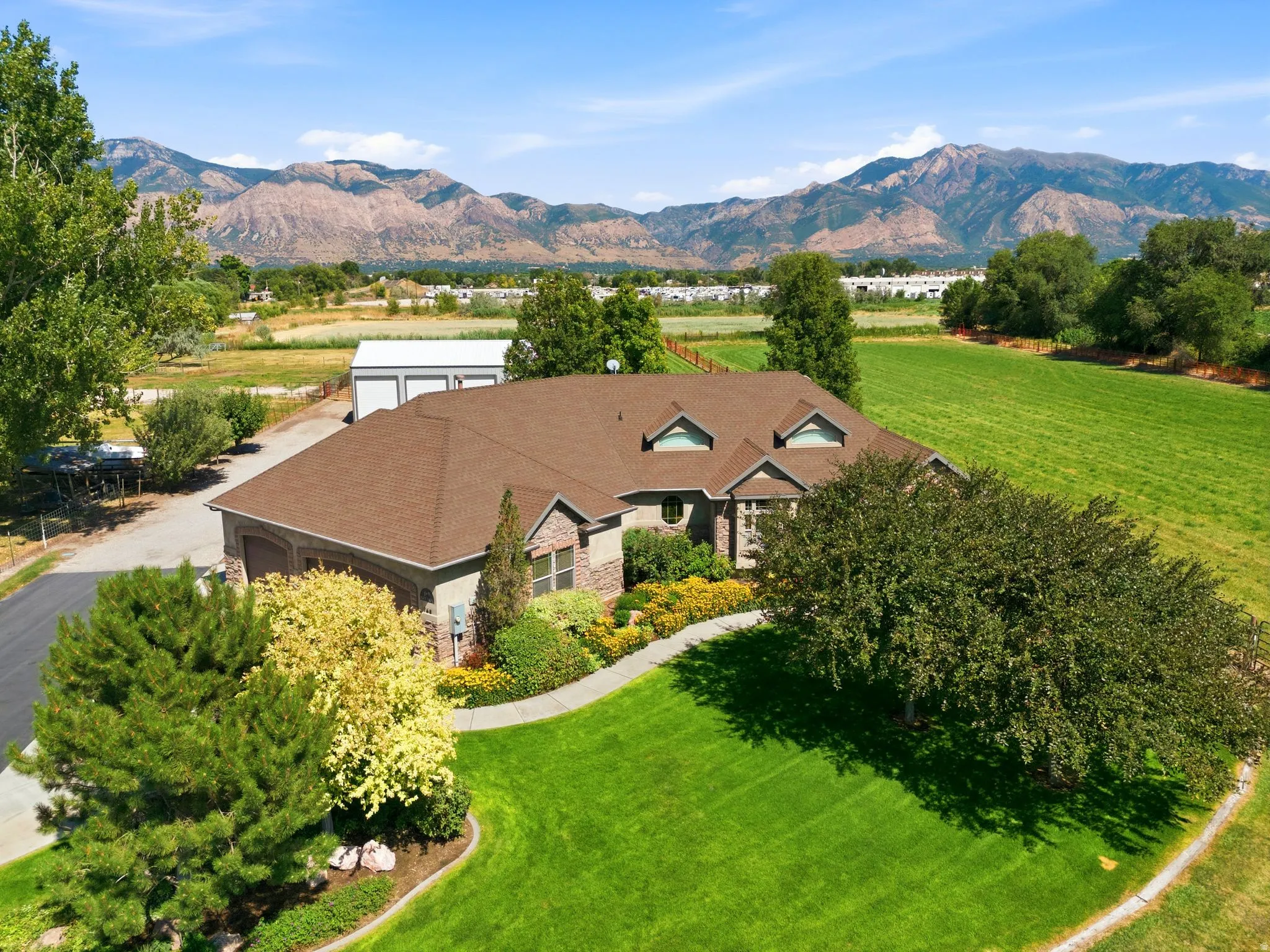 Expansive residential property with a stone and siding exterior
