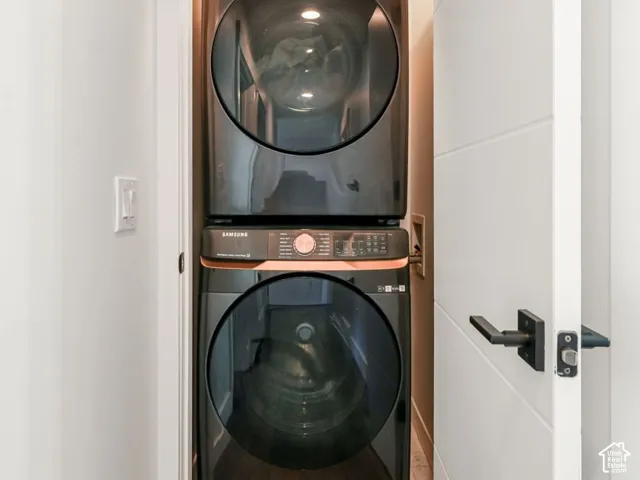 Stacked washer and dryer within a dedicated laundry alcove