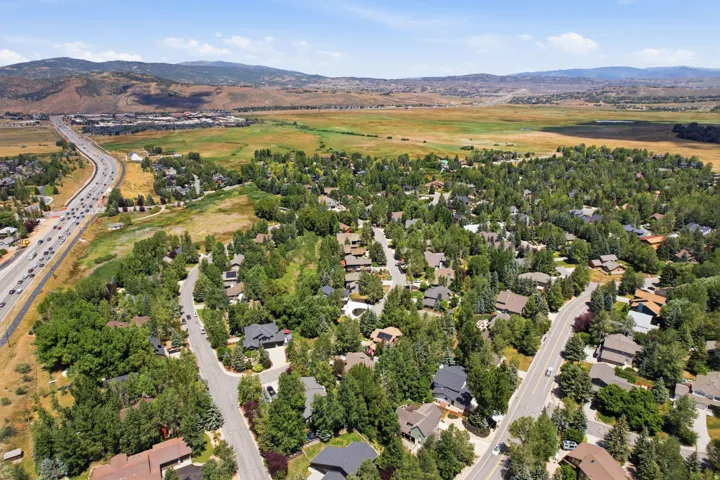 Expansive residential area featuring numerous mature trees and a paved roadway network