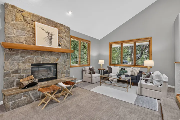 Stone fireplace with a substantial timber mantel