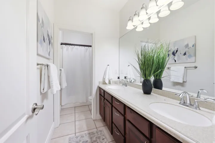 Dual vanity with undermount sinks and chrome fixtures, set in a light-toned countertop