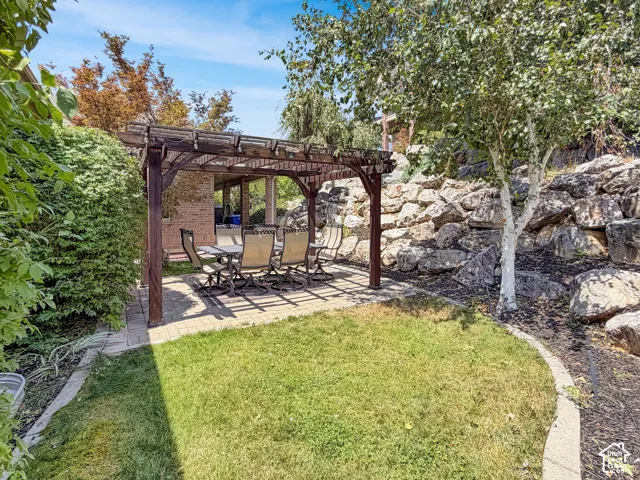 Secluded backyard with a pergola