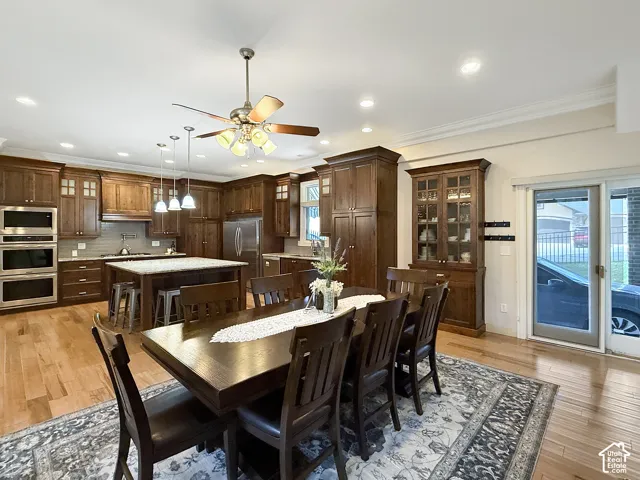 Formal or semi formal dining room, with hardwood flooring, crown molding and a fireplace.