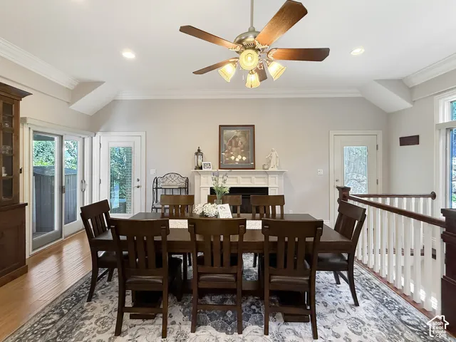 Formal or semi formal dining room, with hardwood flooring, crown molding and a fireplace.