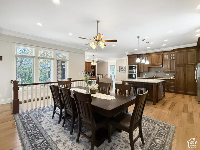 Formal or semi formal dining room, with hardwood flooring, crown molding and a fireplace.