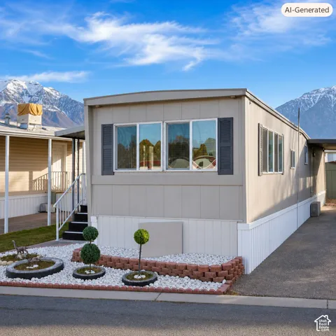 Exterior featuring light-toned siding, white skirting, and dark louvered shutters