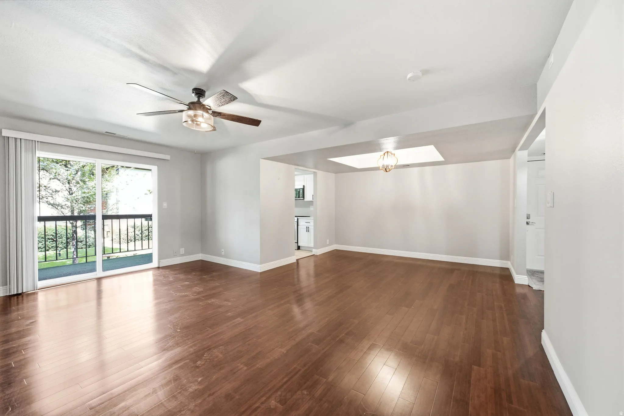 Spacious living area, lots of light, and access to a covered deck.