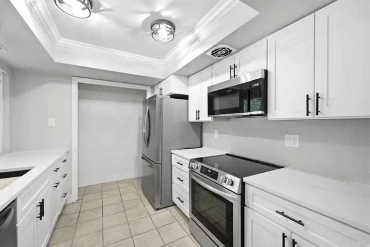 Stainless steel appliances with electric stove.