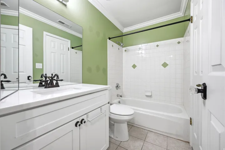Second bathroom featuring a white vanity with a rectangular sink, oil-rubbed bronze faucet, and a large mirror