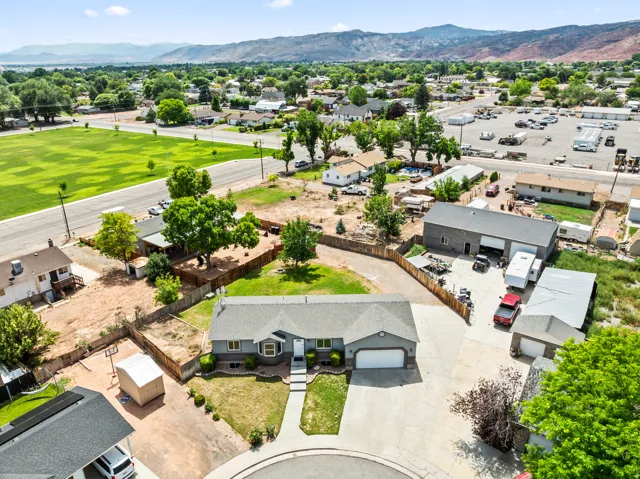 Single-story residence featuring a two-car garage and a paved driveway