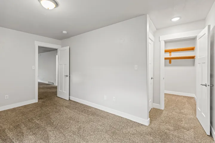 Neutral-toned walls complementing plush carpet flooring