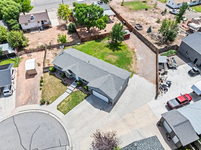 Single-story residence featuring a gray shingle roof and an attached two-car garage