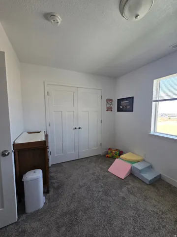Neutral gray carpet flooring complements white walls and trim