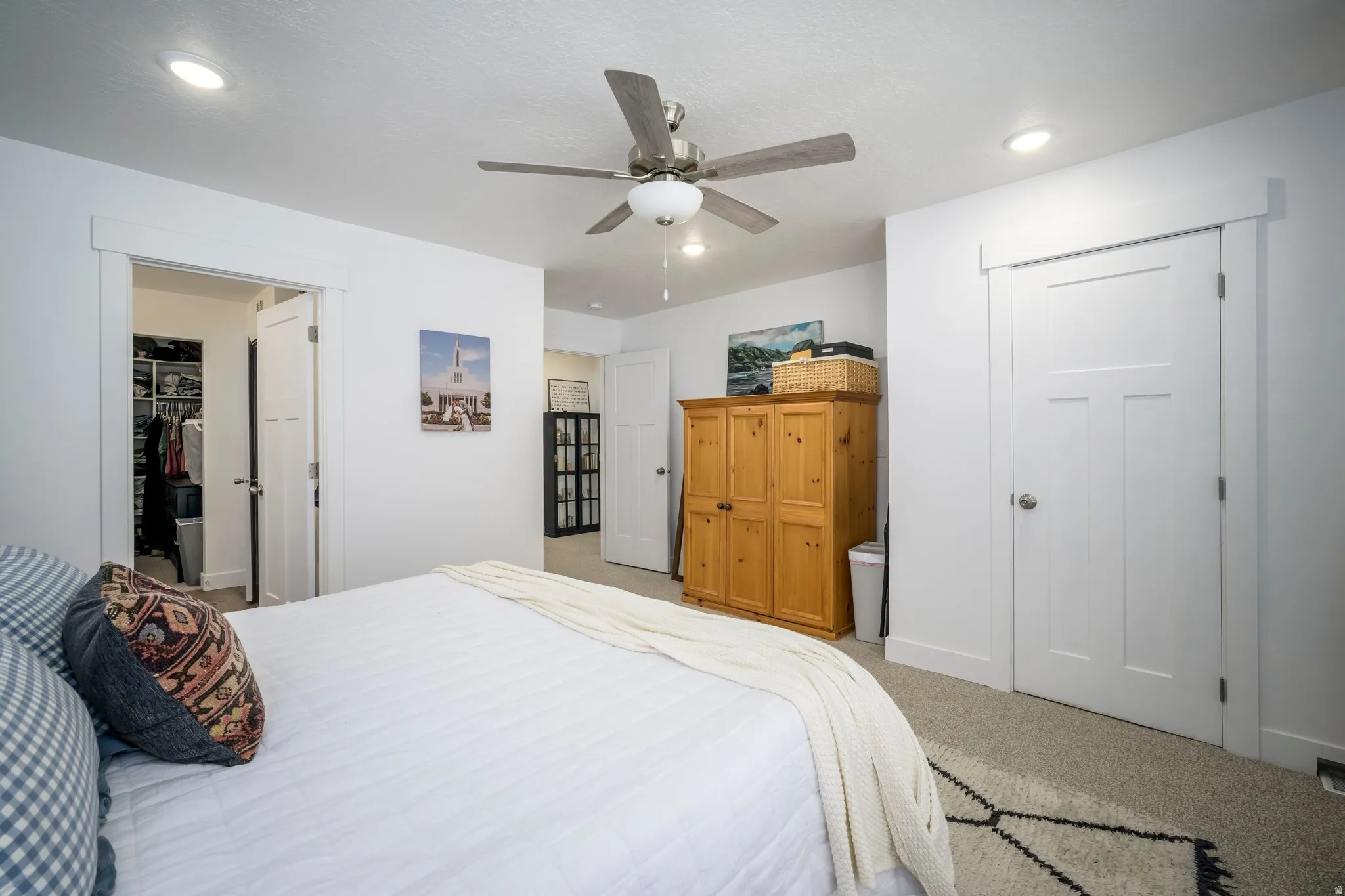 Primary Bedroom featuring modern recessed lighting, a ceiling fan with light fixture, light gray carpet, and white trim