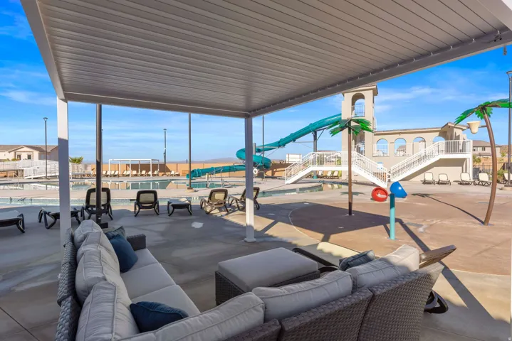 Covered outdoor lounge area with concrete flooring