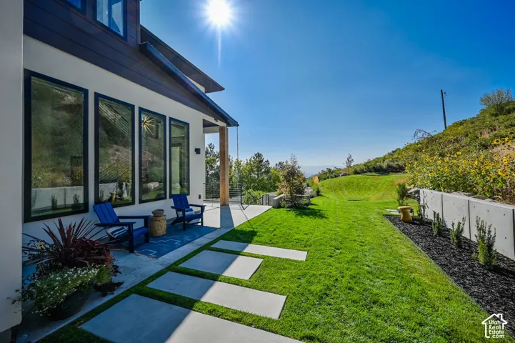 Expansive concrete patio with a modern stepping stone pathway