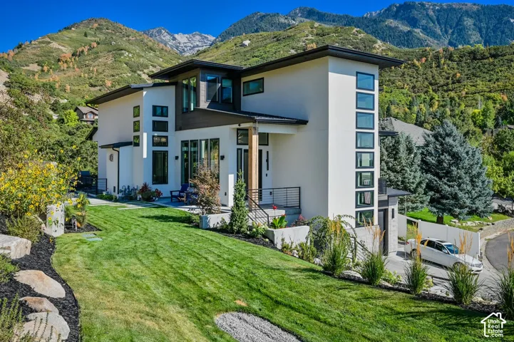 Modern architectural design with a white exterior and dark trim