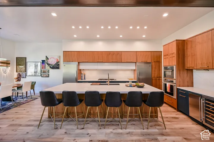 Expansive kitchen island with seating for six, featuring a light-toned countertop