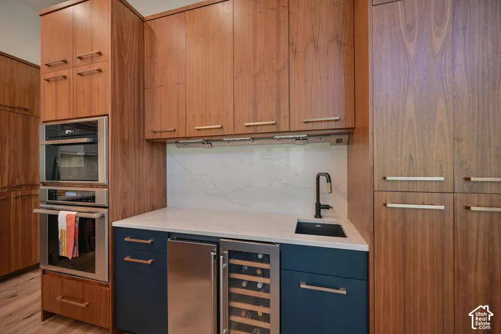 Built-in stainless steel appliances, including a double oven and beverage refrigerator