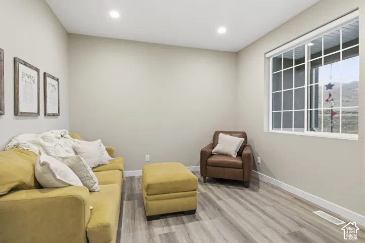 Room with light-toned walls and wood-finish flooring