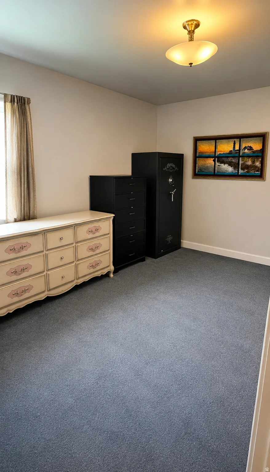 Neutral wall tones paired with blue carpeting