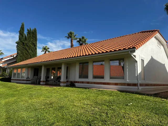 Exterior showcasing a red tile roof and white stucco facade