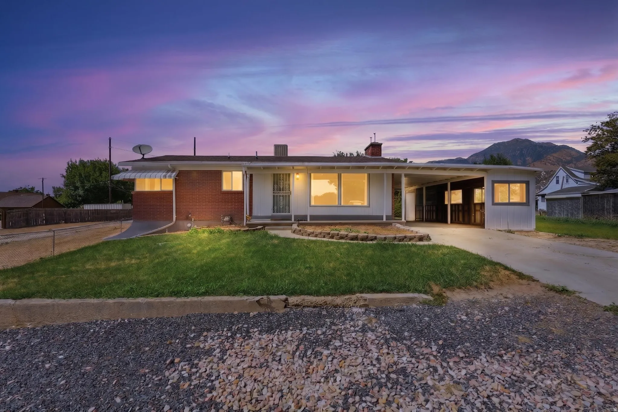 Single-story residence featuring a partial brick facade and a multi-pane front door