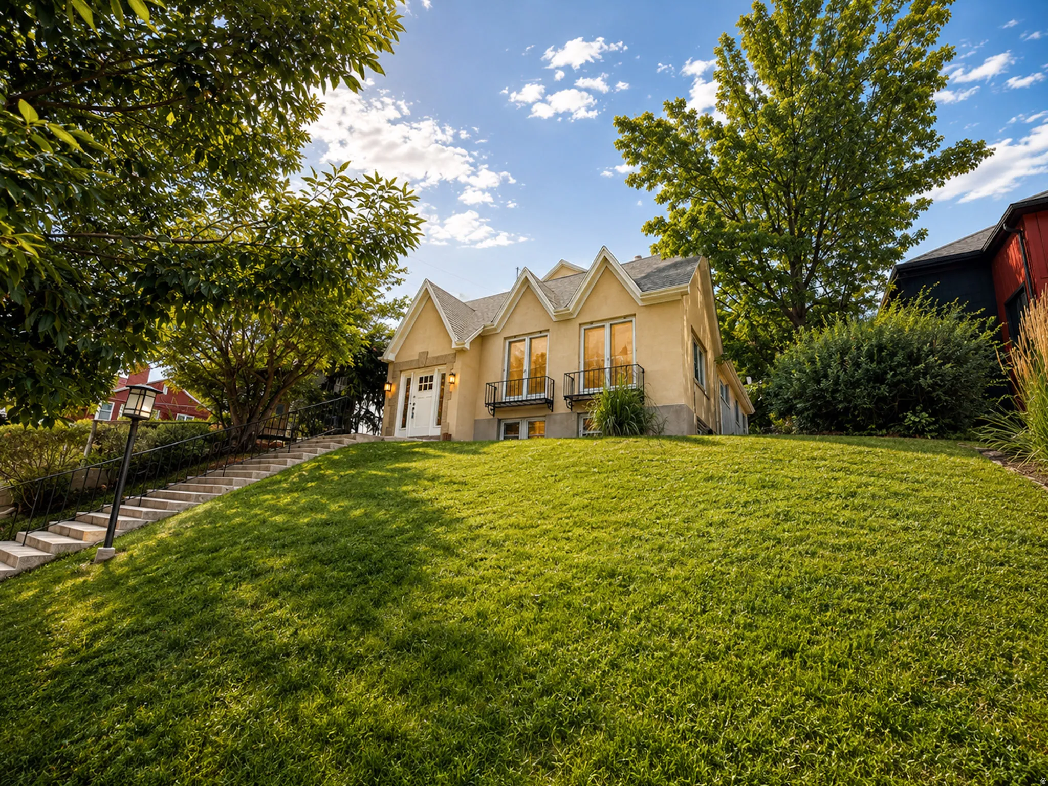 Stucco exterior with multiple gabled rooflines