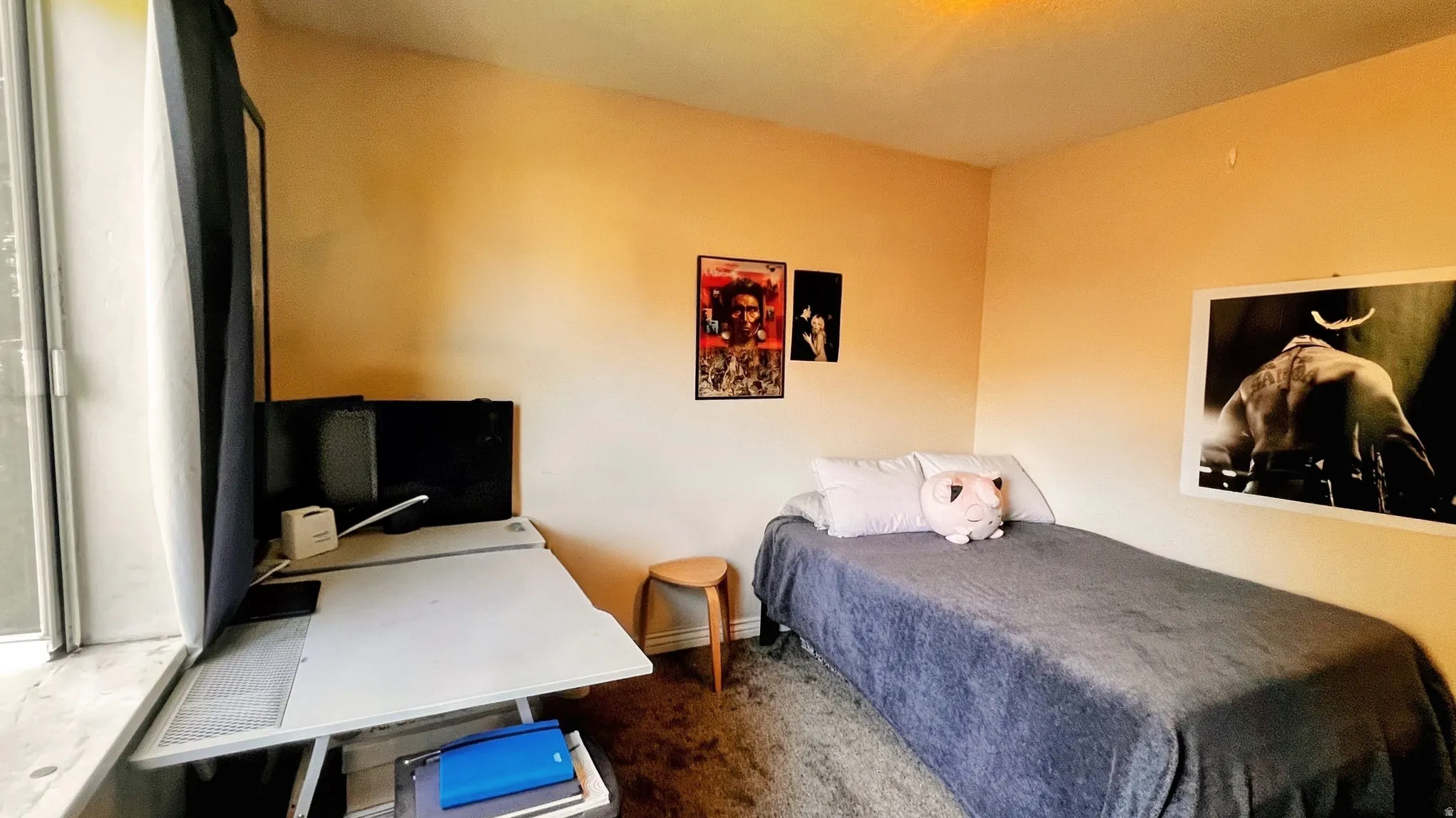 Room featuring neutral wall tones and dark-toned flooring