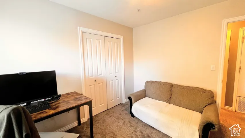 Neutral wall tones and carpeted flooring