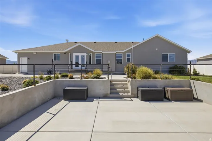 Expansive concrete patio with integrated retaining walls
