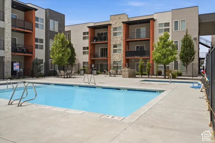 Outdoor swimming pool with concrete decking
