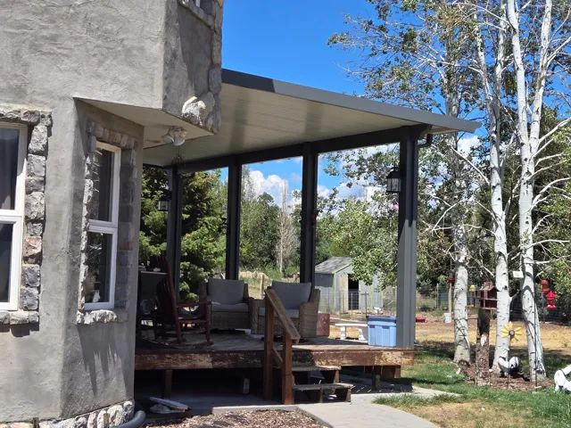 Stone and stucco exterior with white-framed windows