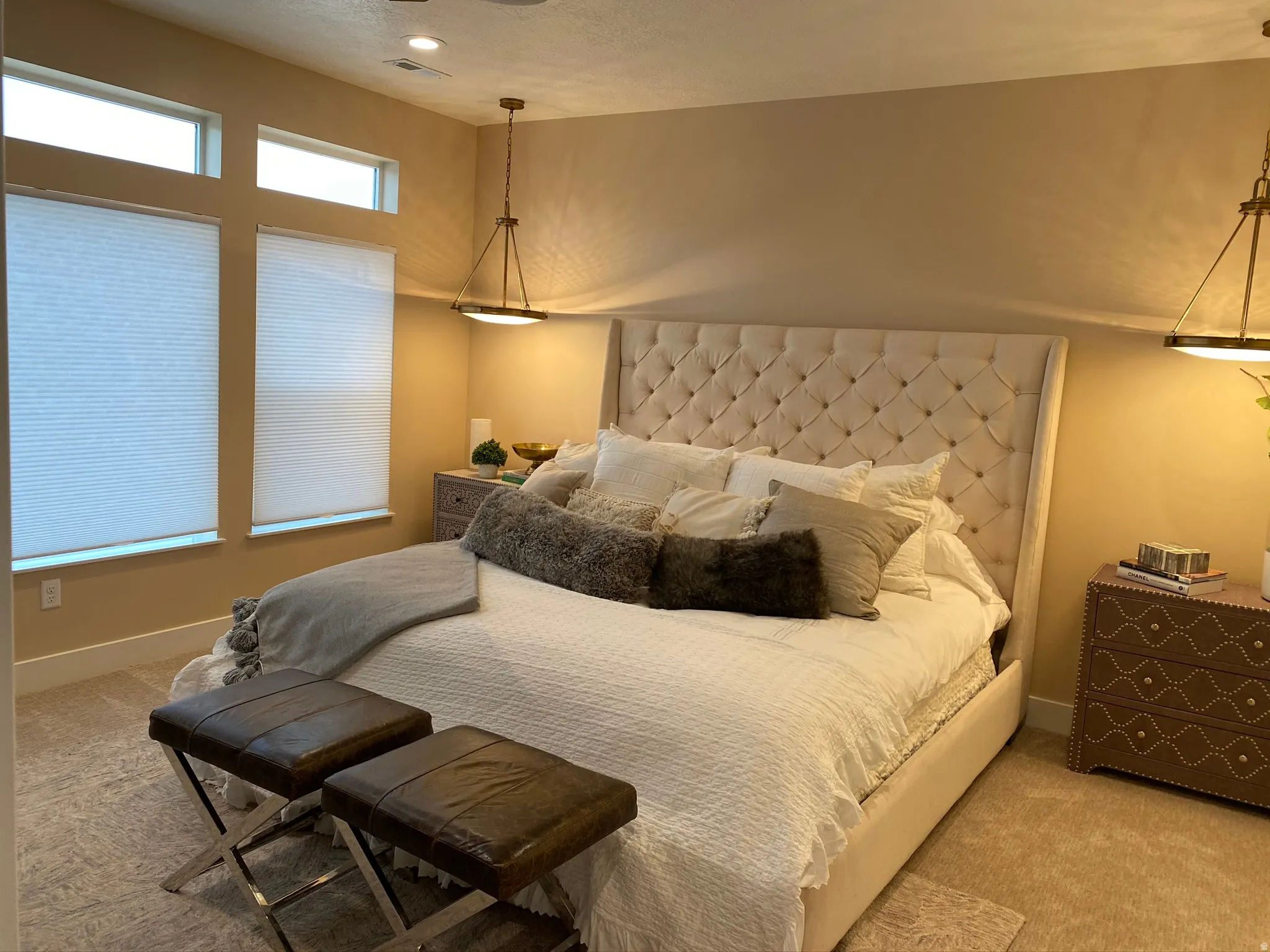 Bedroom featuring multiple windows with blinds, recessed lighting, and a textured ceiling