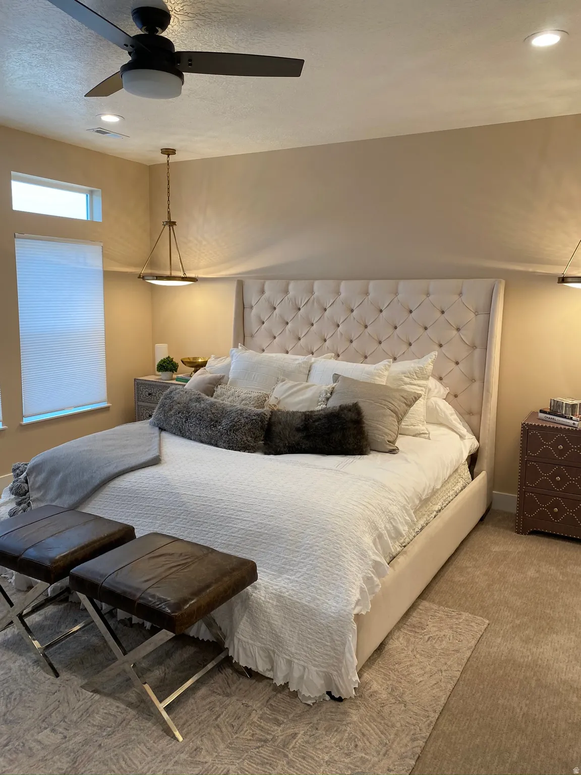 Spacious room featuring neutral-toned walls, recessed lighting, and a ceiling fan with light fixture