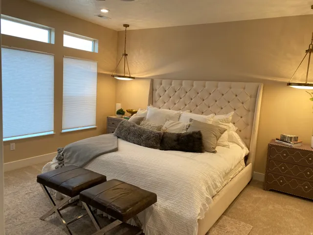 Bedroom featuring multiple windows with blinds, recessed lighting, and a textured ceiling
