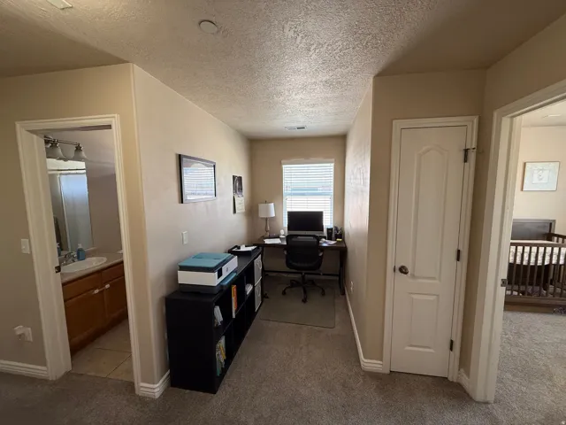 Dedicated workspace featuring a window with horizontal blinds
