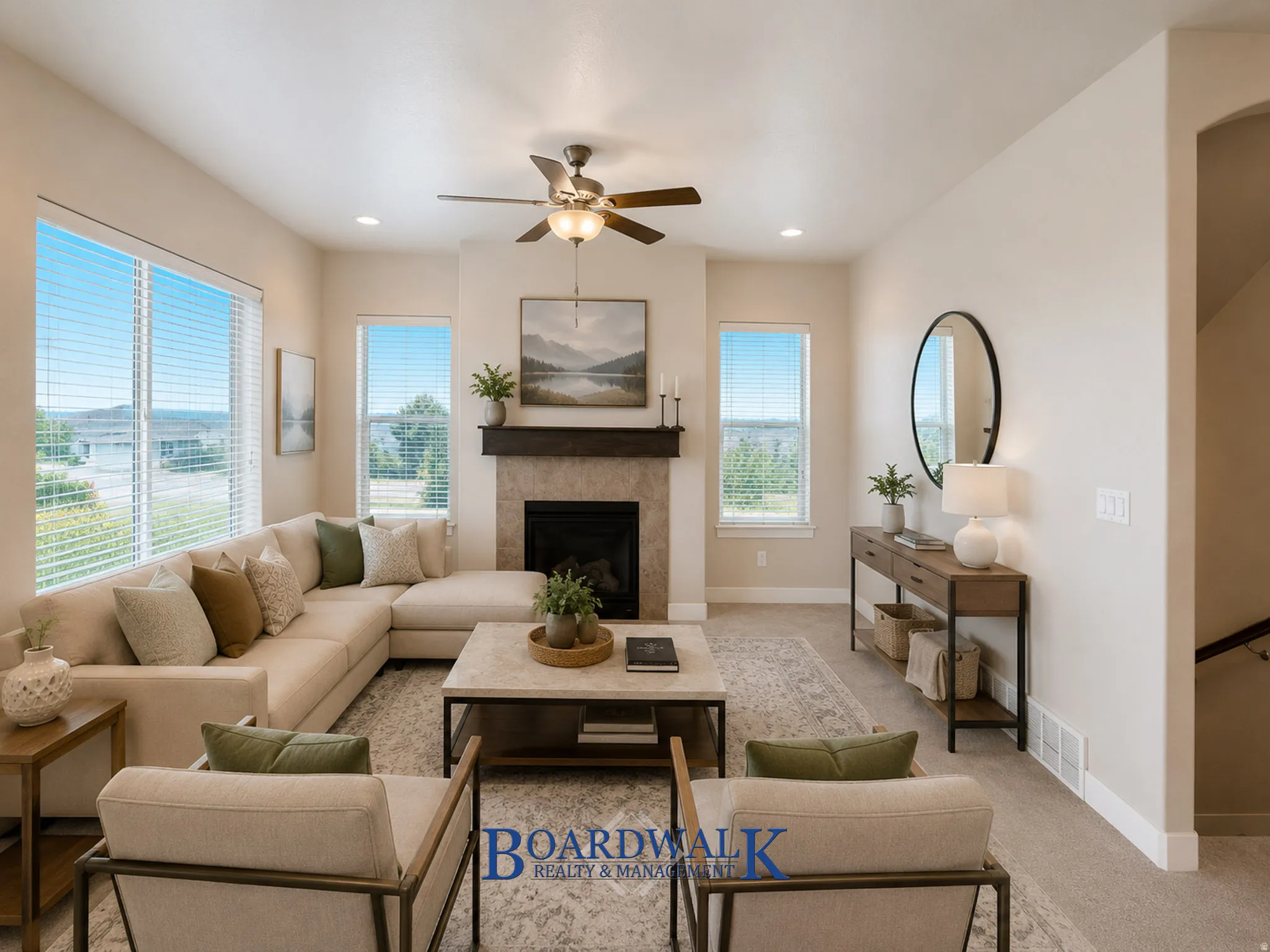 Living area featuring a fireplace with a tile surround and wood mantel, recessed lighting, and a ceiling fan