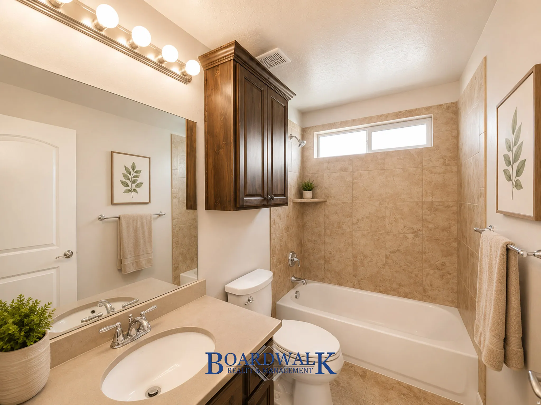 Bathroom featuring a vanity with an integrated sink and chrome faucet, a large wall mirror, and a five-bulb vanity light fixture