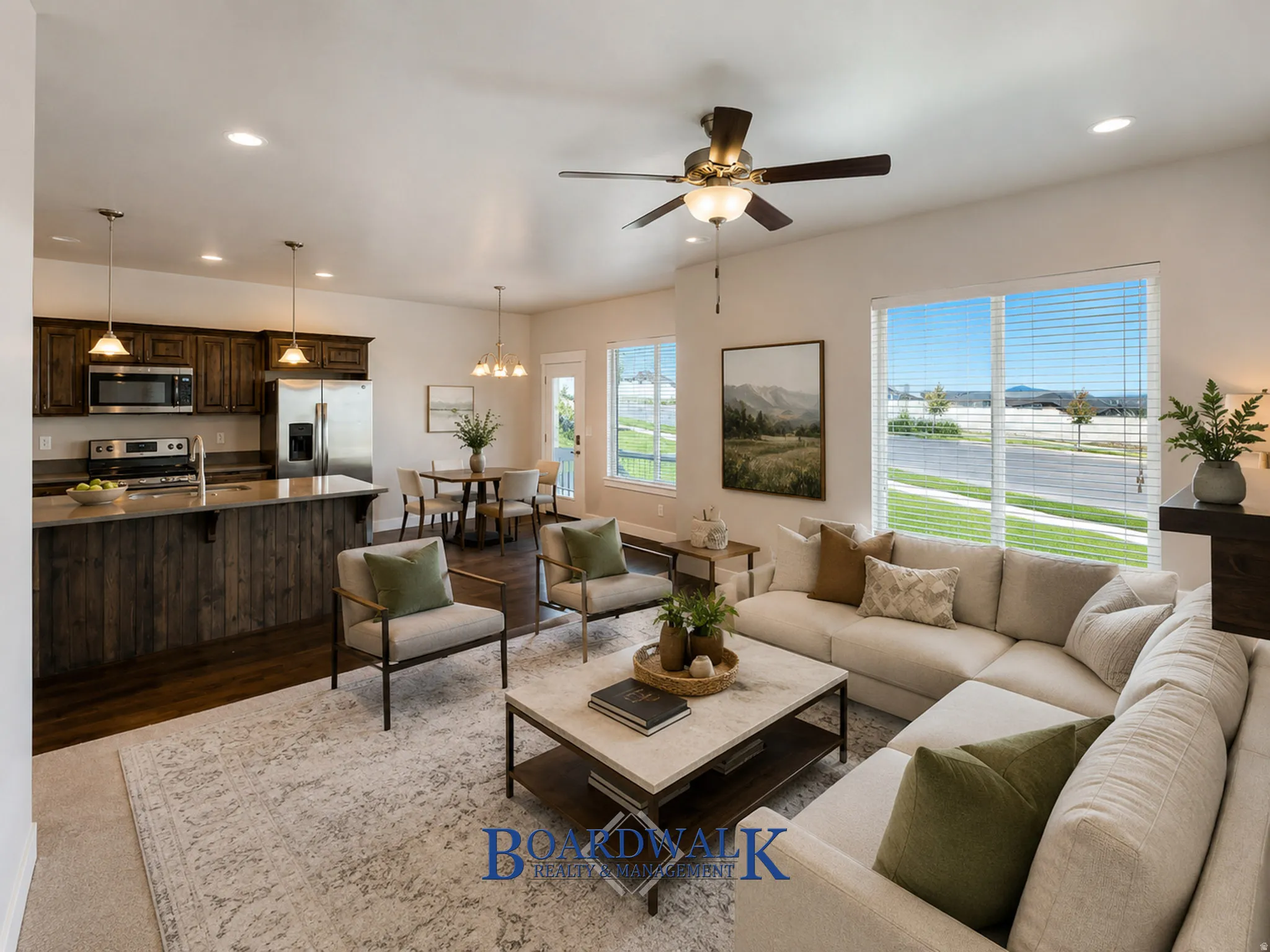 Open concept living area with wood-finish flooring