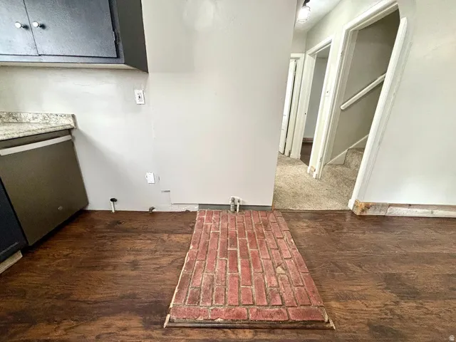 Brick hearth with wood-finish flooring