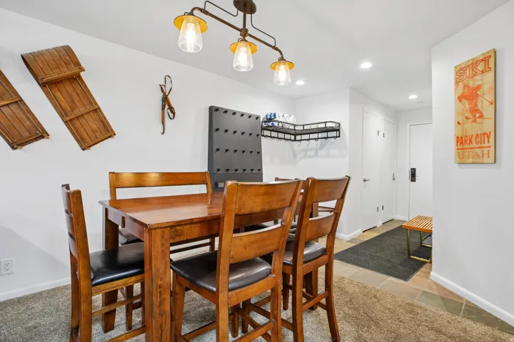 Dining area featuring a rectangular wood-finish table with seating for four