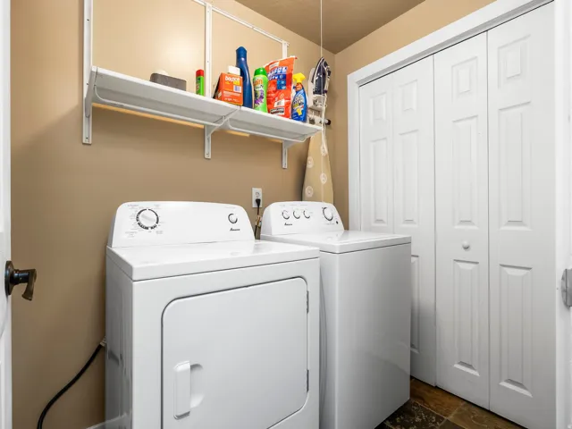 Dedicated laundry area featuring a white dryer and washing machine