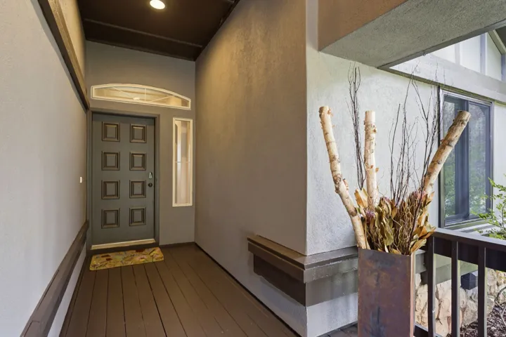 Inviting entryway featuring wood-finish flooring and a paneled entry door