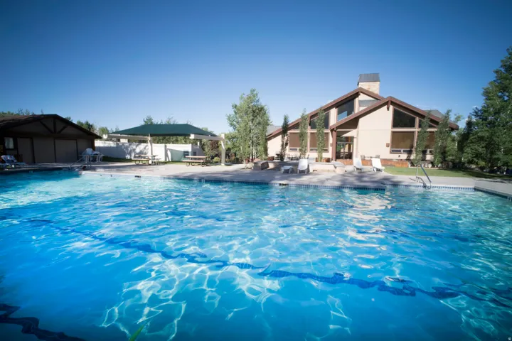 Outdoor swimming pool with a surrounding concrete deck