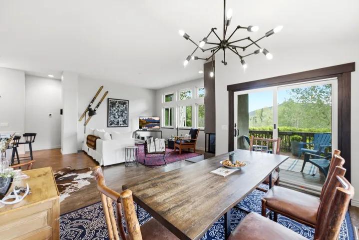 Open-concept living area with wood-finish flooring