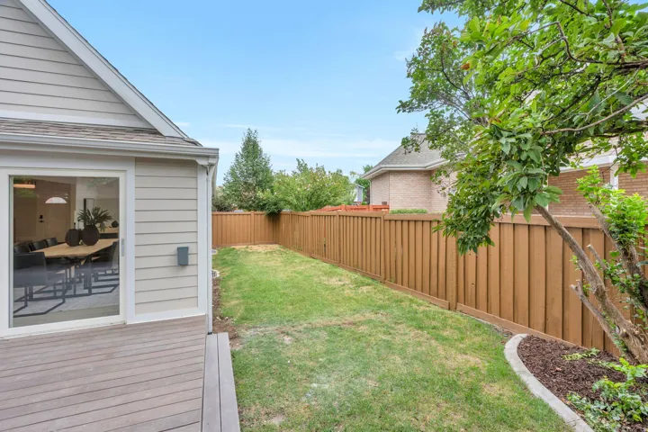 Exterior patio with composite decking and sliding glass door access