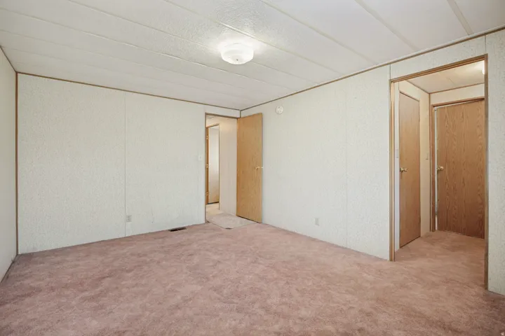 Open interior space featuring textured wall panels and a dome ceiling light fixture