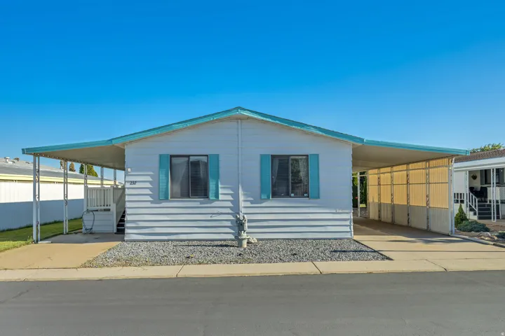 Light blue exterior siding with matching shutters
